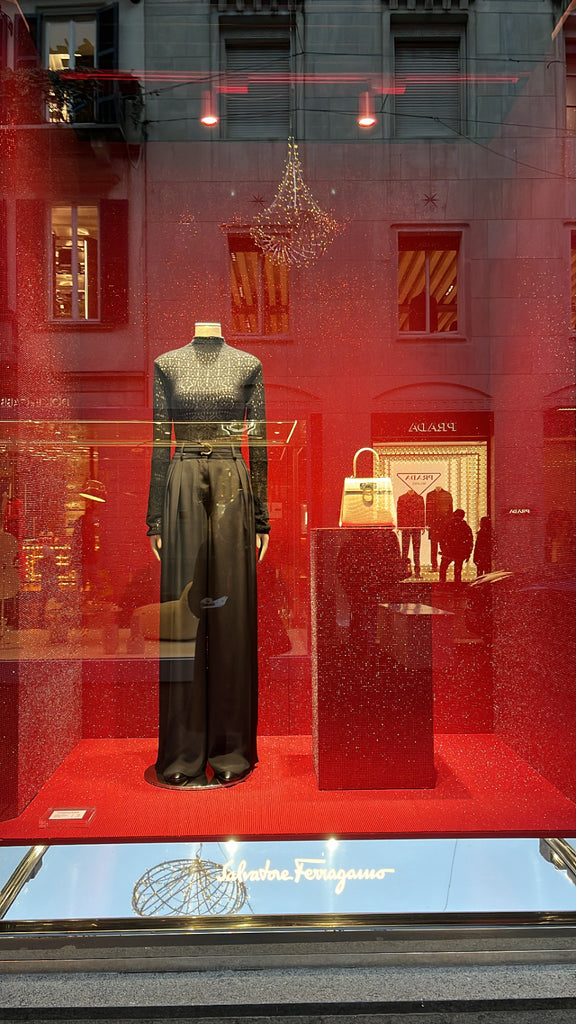Mannequin in silk pants and patterned top in storefront window
