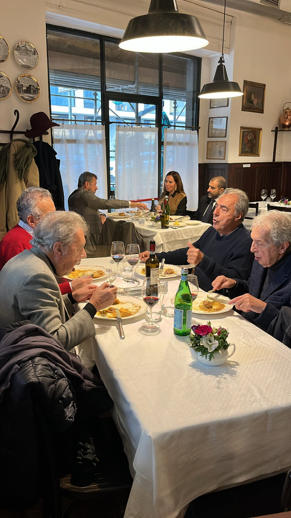 Four Italian men eating lunch