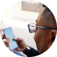 Man reading his phone with Slastik Bifocal Sunglasses on