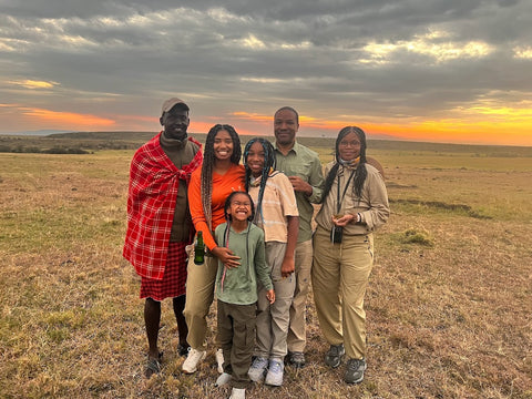 family with guide during sunset