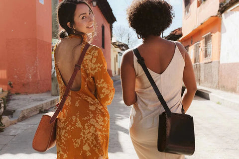 Two women wearing the sustainable, ethical Ellie Handbag in Brown and Black | Wearwell