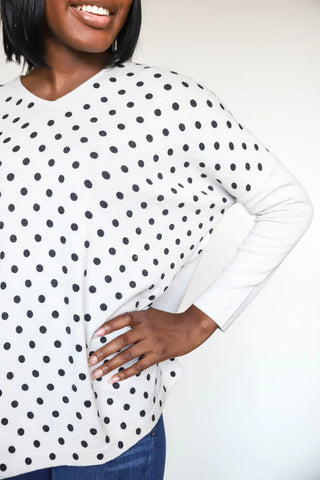 Woman in polka dot sustainably made secondhand sweater from wearwell