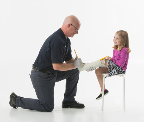 Sean Greer, Certified Licensed Orthotist (CO/LO), is casting Emily for an ankle-foot orthotic.