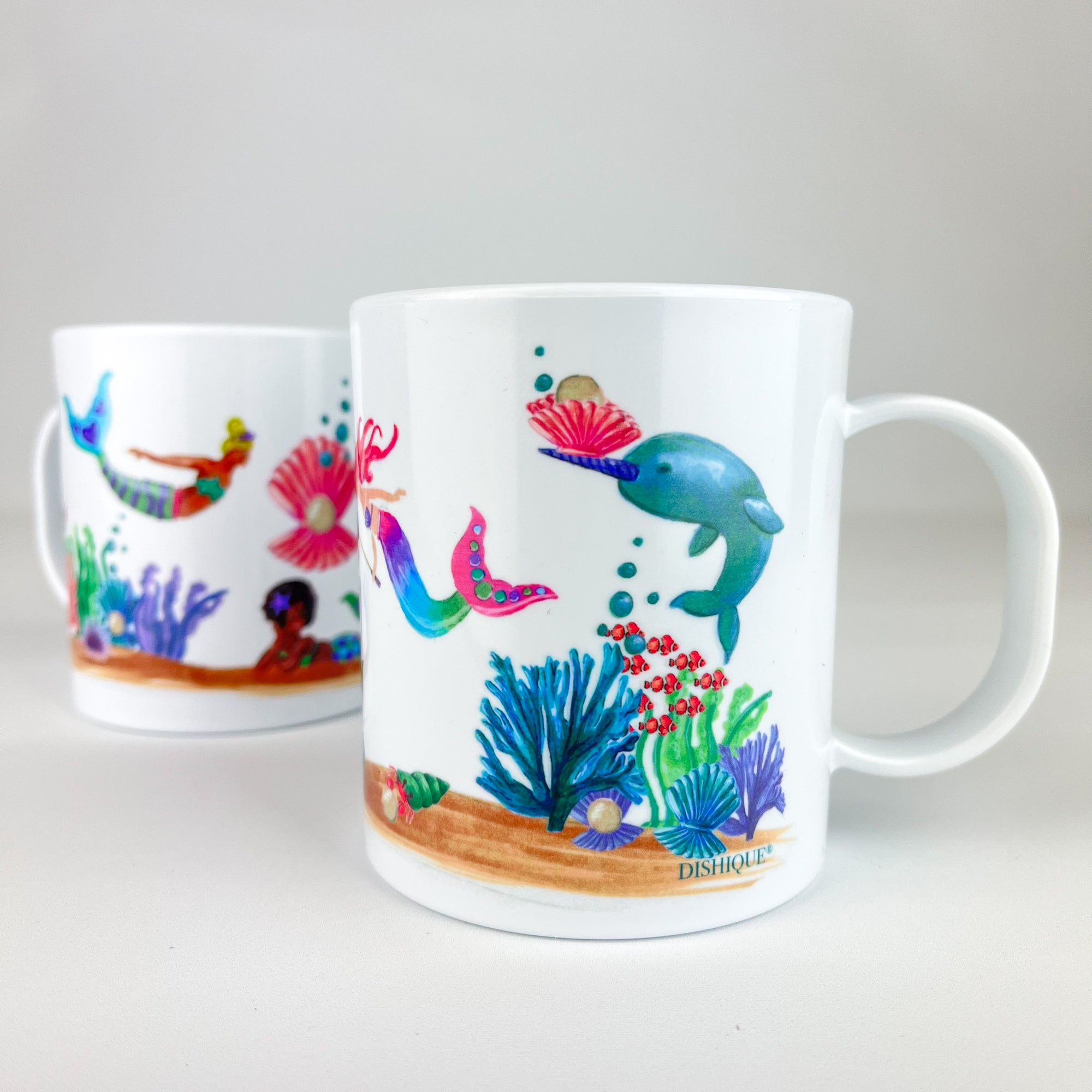 https://cdn.shopify.com/s/files/1/0363/2290/2151/products/PlasticMug_MermaidColorsandShapes_2000x.jpg?v=1657039025