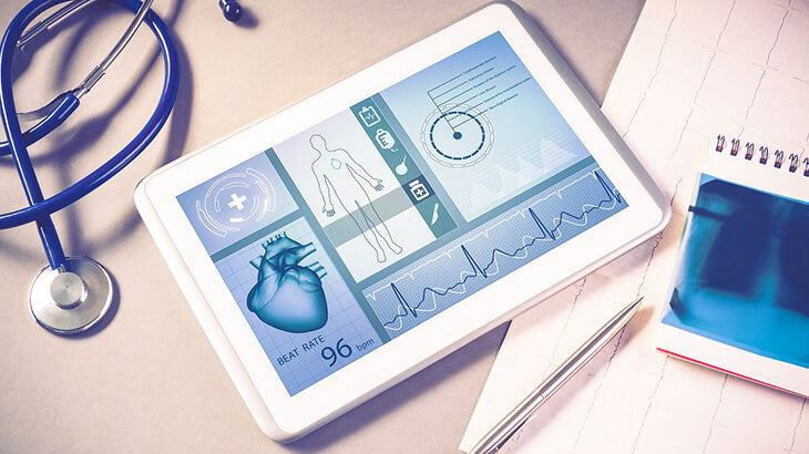 A tablet used for health screening services on a desk