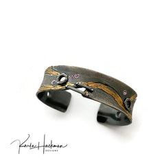 Wave Statement Cuff with pink sapphires, oxidized sterling silver, and 24K gold