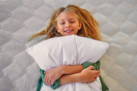 Kids Latex Pillow - young child hugging pillow
