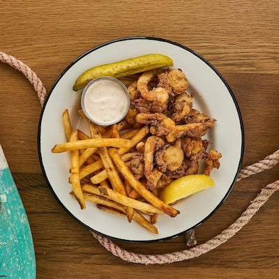 plate with fried whole belly clams, fries, tartar, lemon