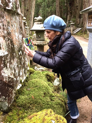 Suzuanne taking a photo of moss in Okunoin Cemetary, Koya, Wakayama, Japan