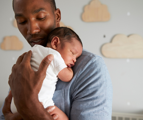 Father holding his newborn baby