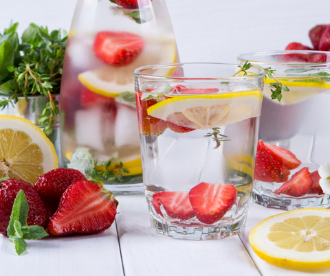 Glasses of water with fruit infused in