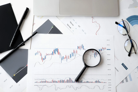 A trader using charts to determine entry and exit points