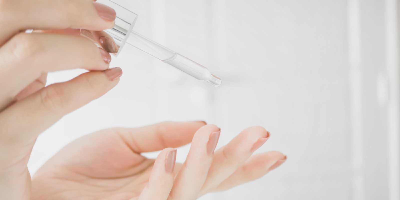 Woman applying serum