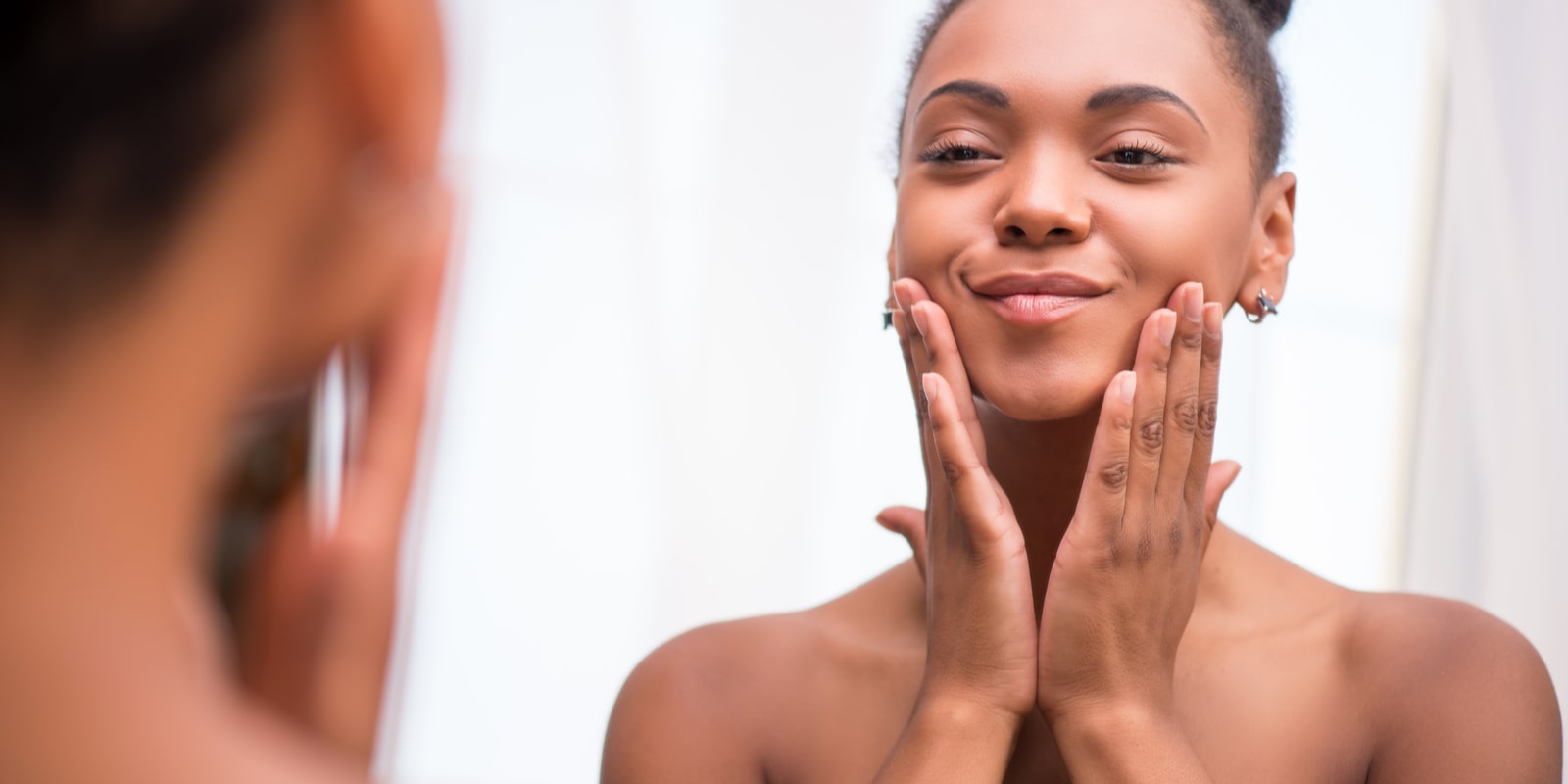 Woman applying skincare products