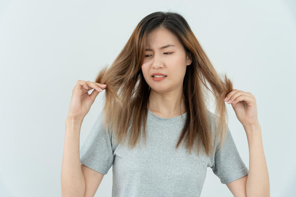 woman worried about damaged hair