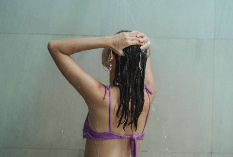 winter hair care tips showering with warm water