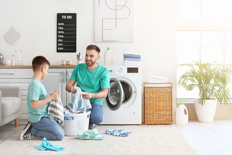 father son doing laundry together