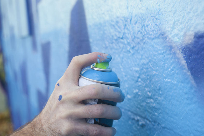 hand holding spray paint