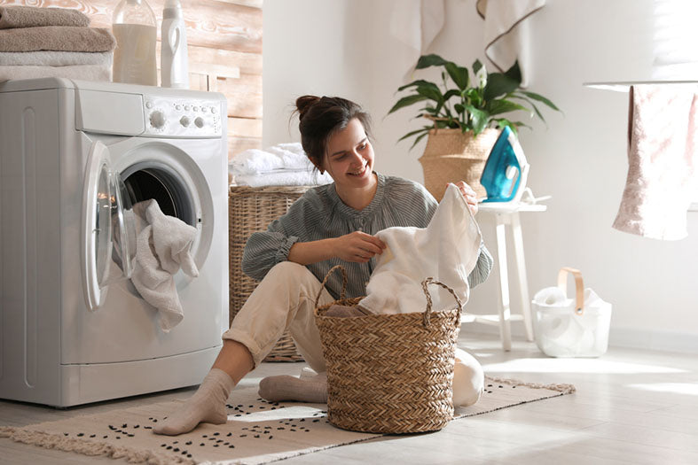 putting away clean laundry