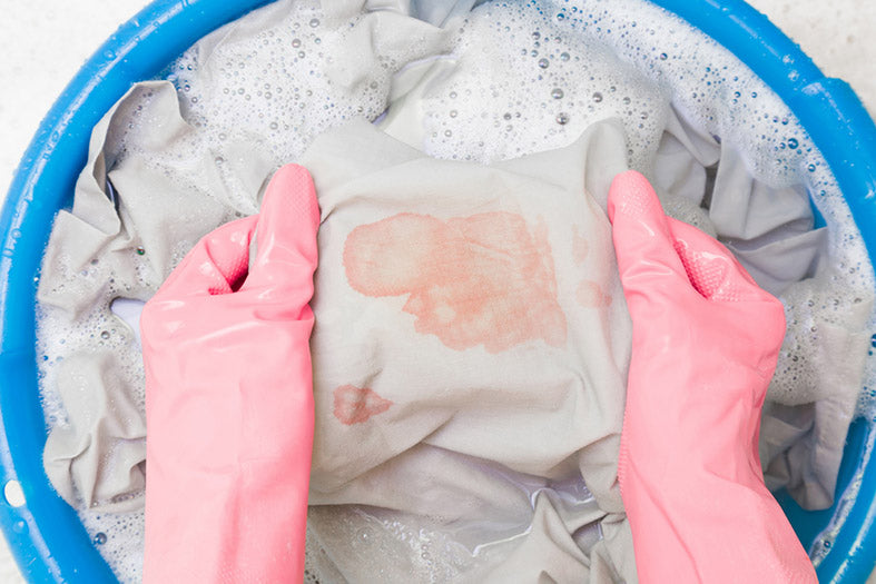 rubber protective gloves washing a sheet