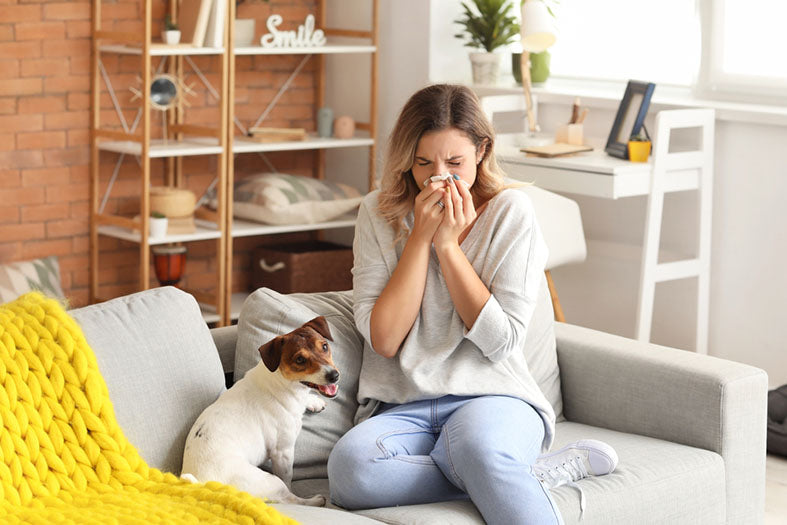 woman blowing nose