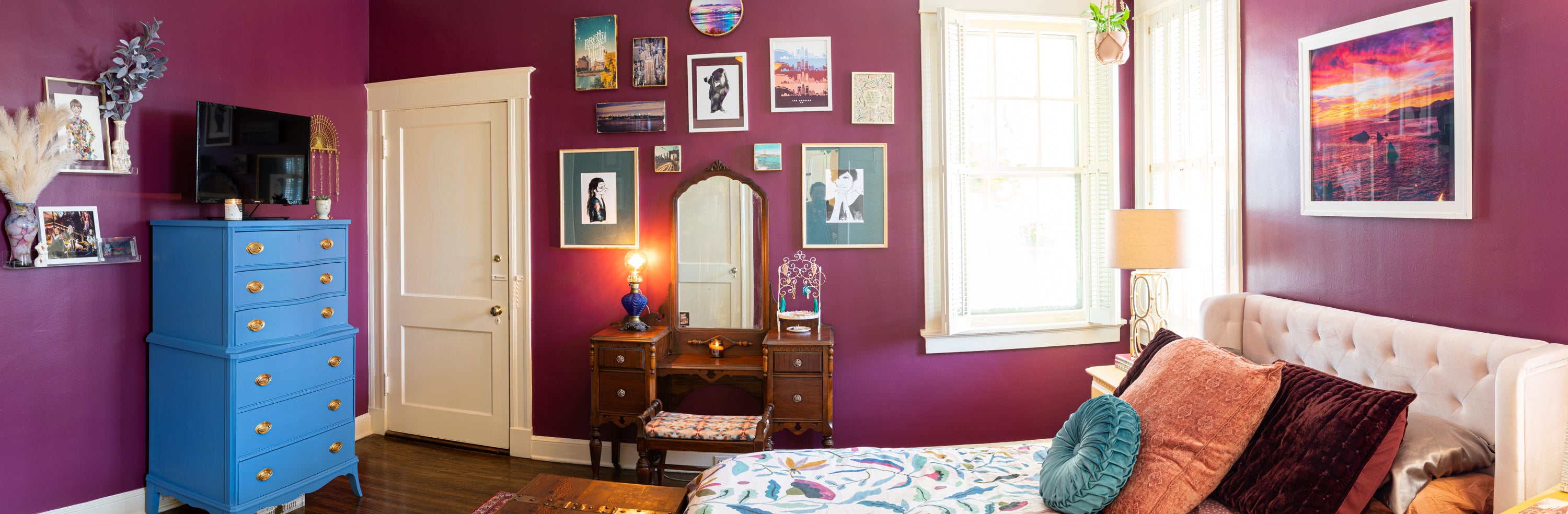 panoramic view of purple bedroom and decor