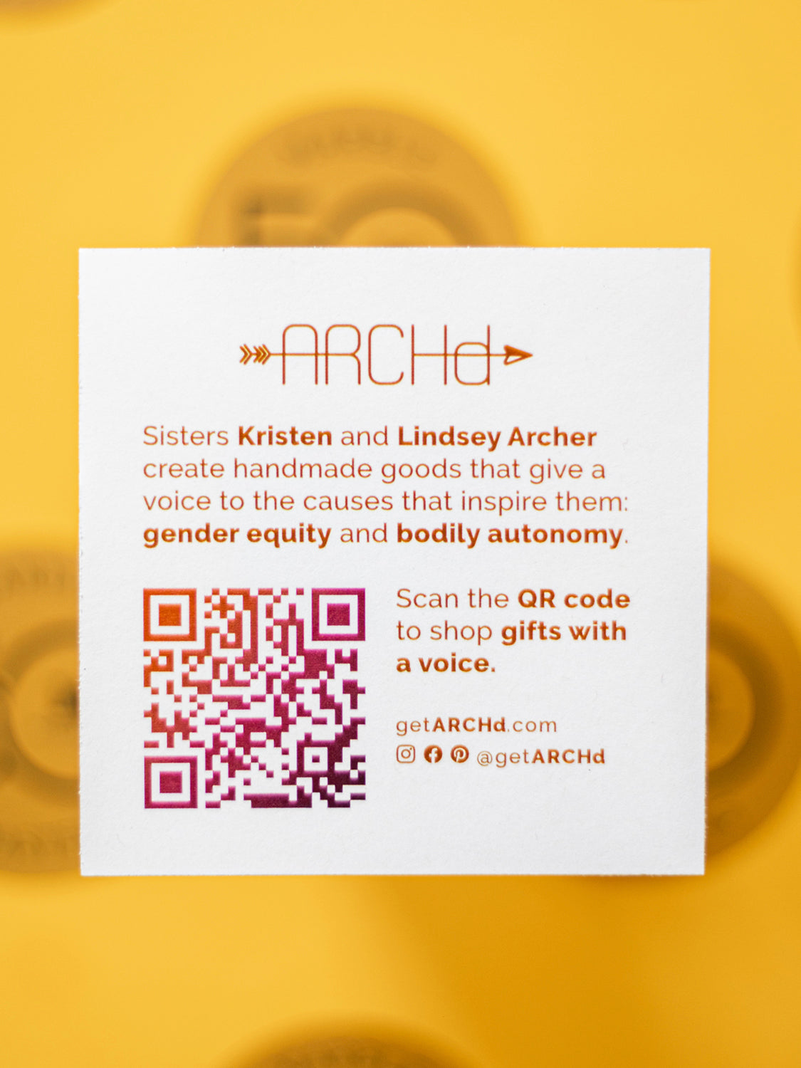 ARCHd info card with QR code on gold background