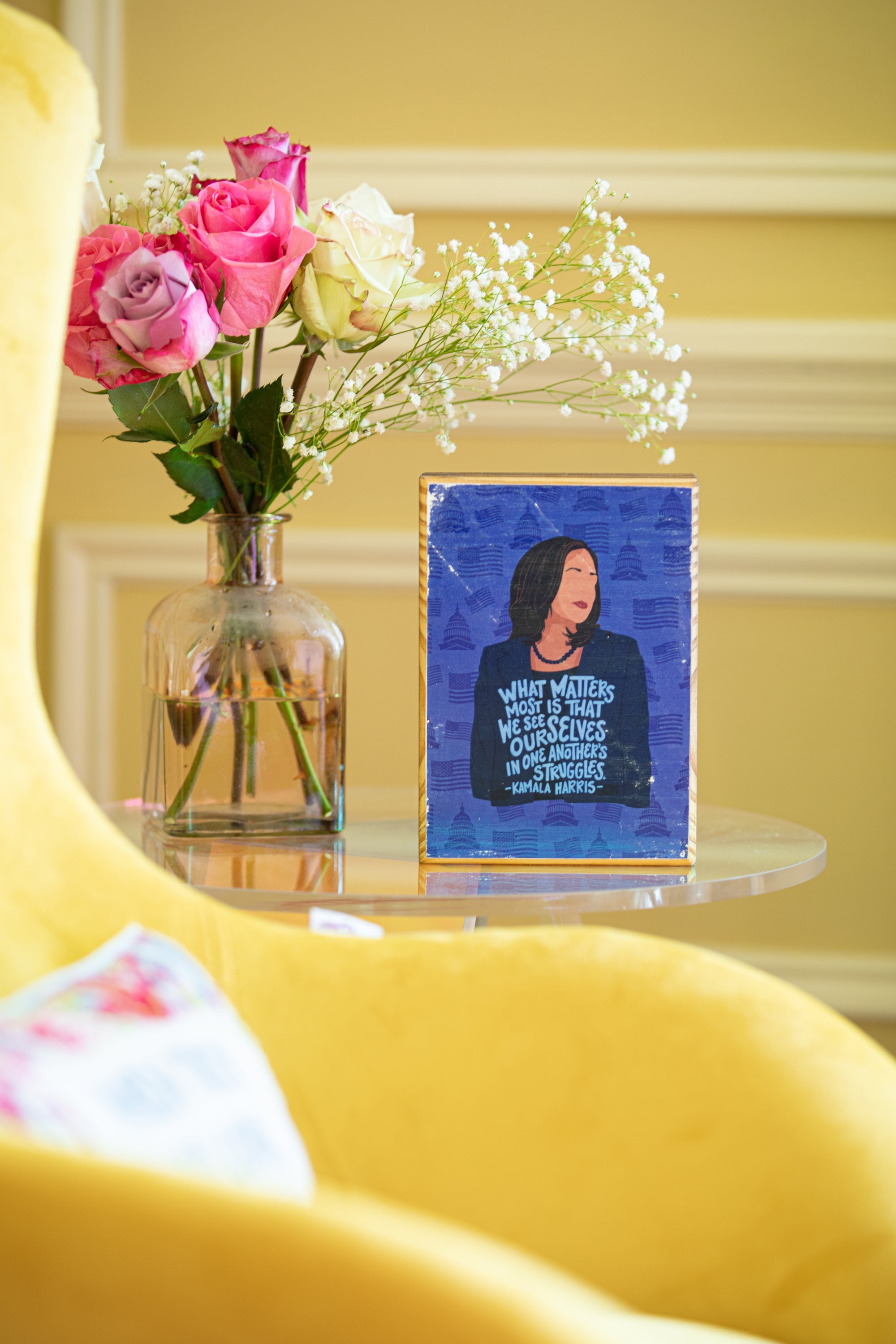Kamala Harris illustration wood art by ARCHd on side table by yellow chair