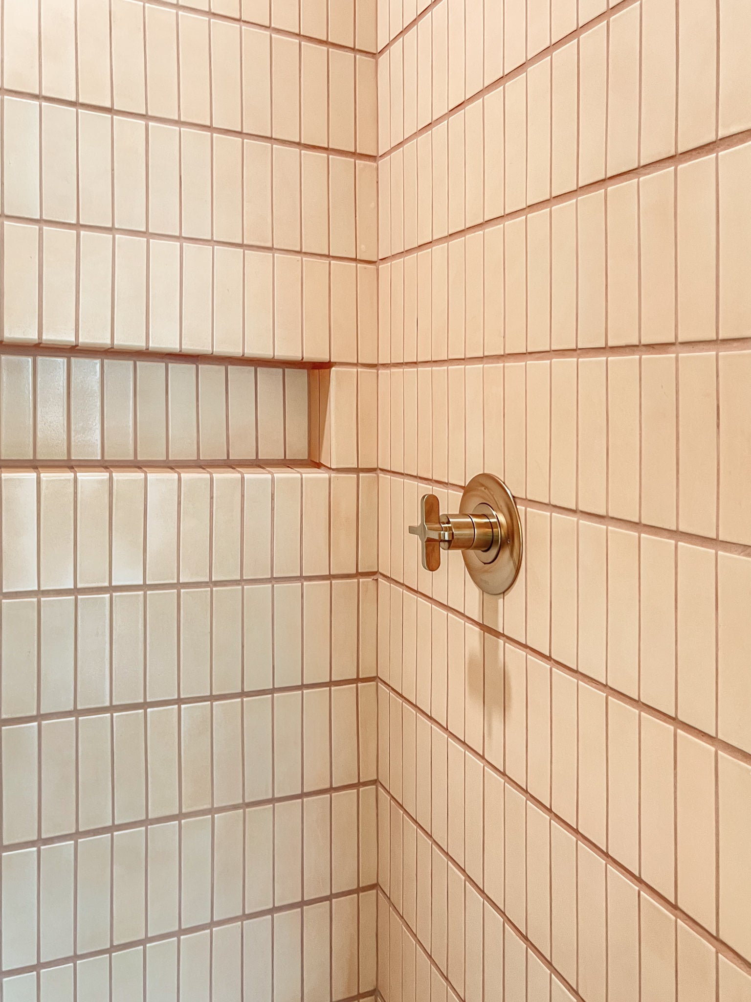 Bathroom walk in shower knob with pink tile wall clay imports