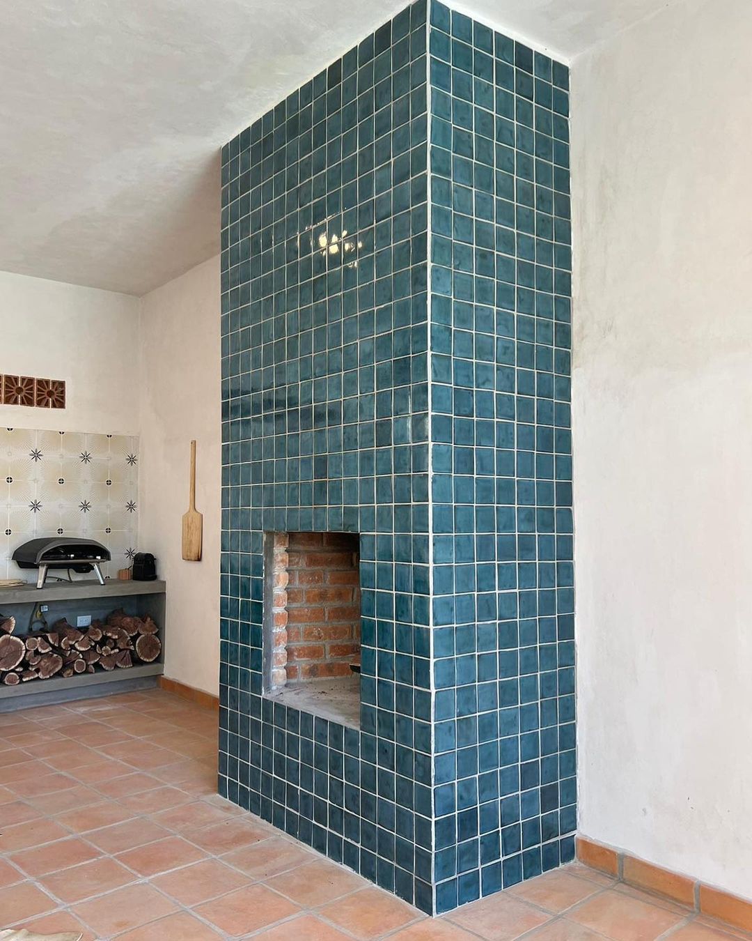 Modern fireplace with blue tiles