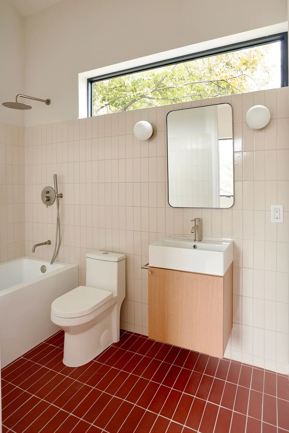 Modern bathroom design with red and white tiles