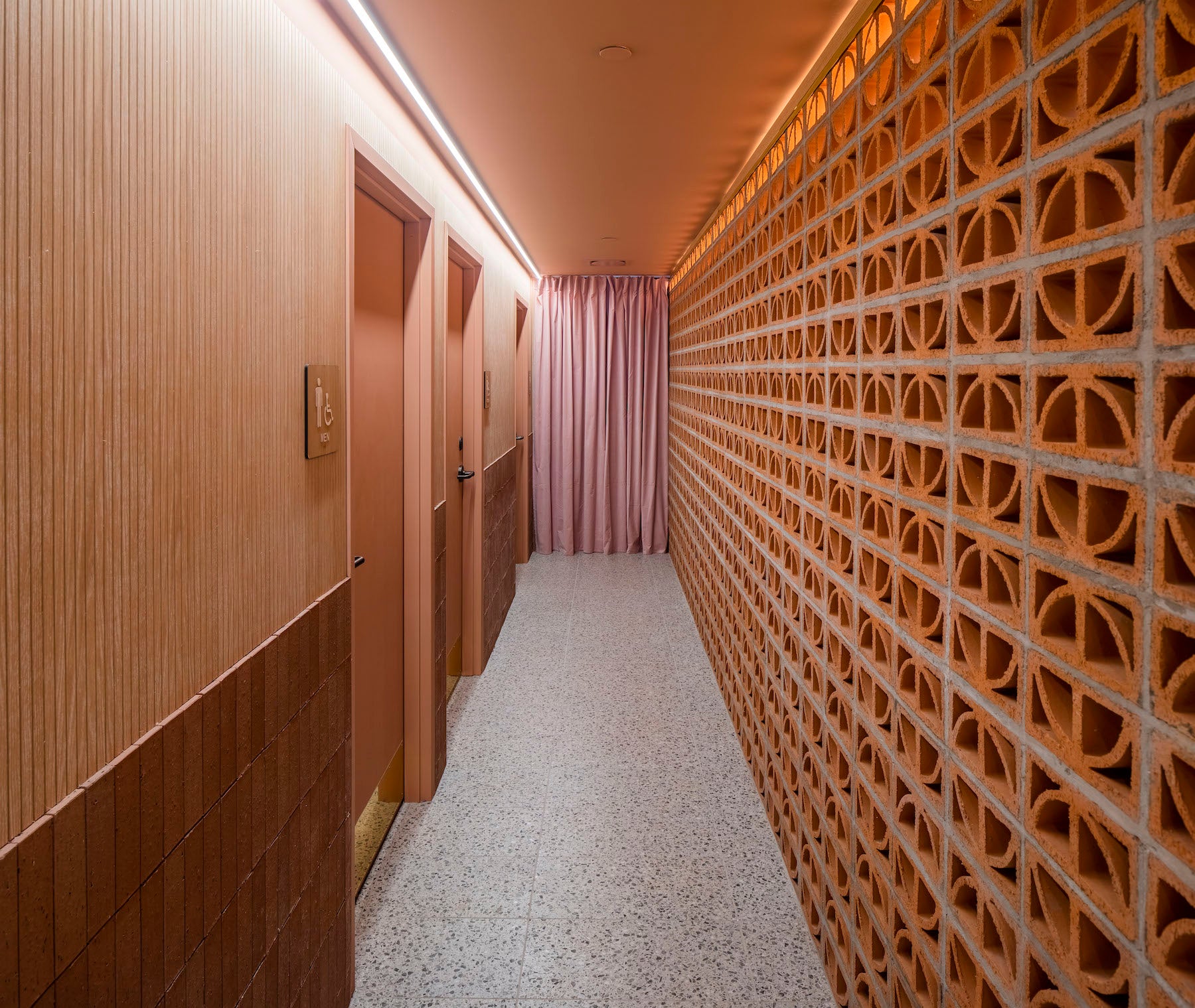 Interior hallway with breeze blocks wall
