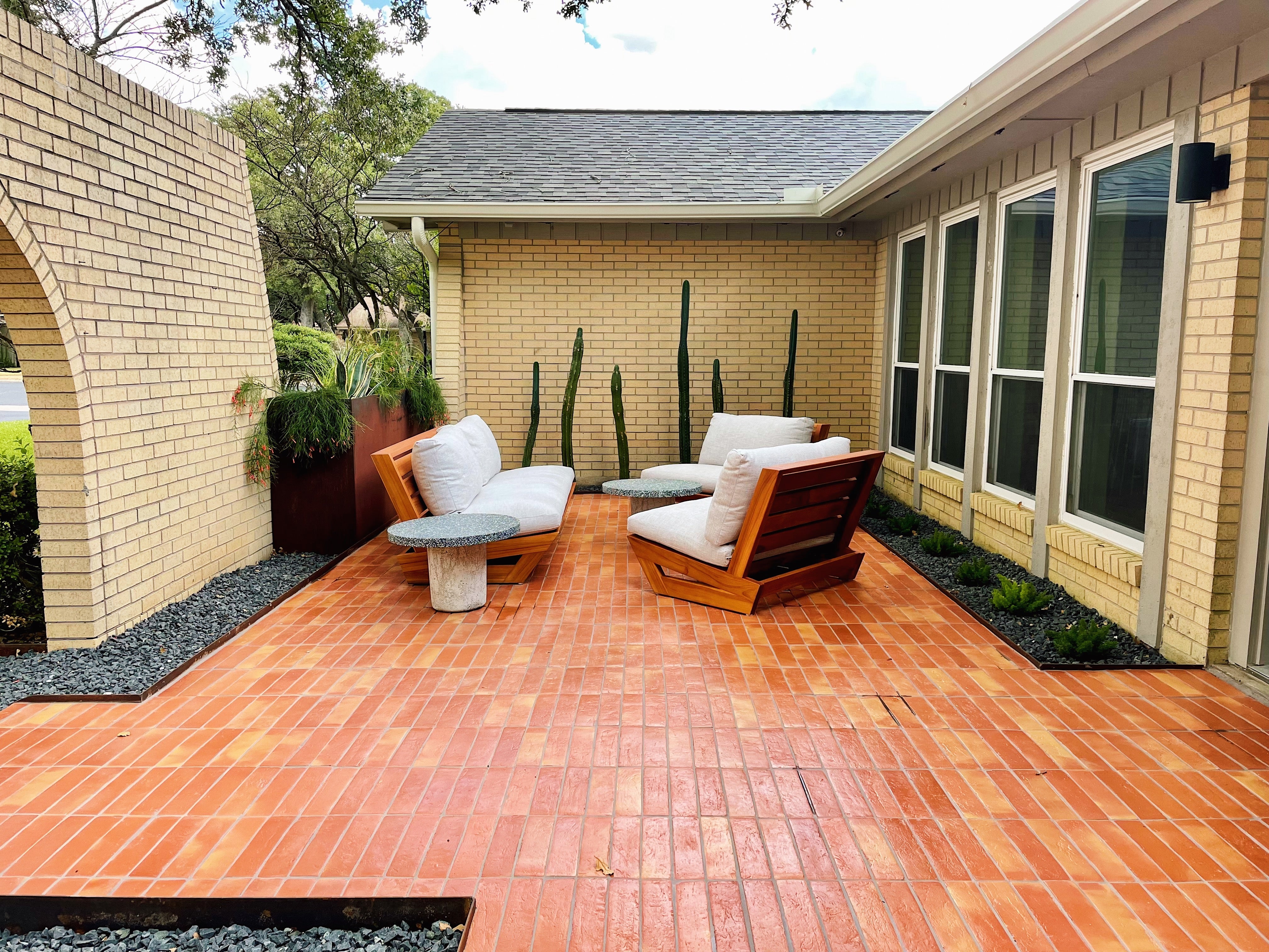 Outdoor patio with glazed terracotta brick floor tile and yellow brick house clay imports