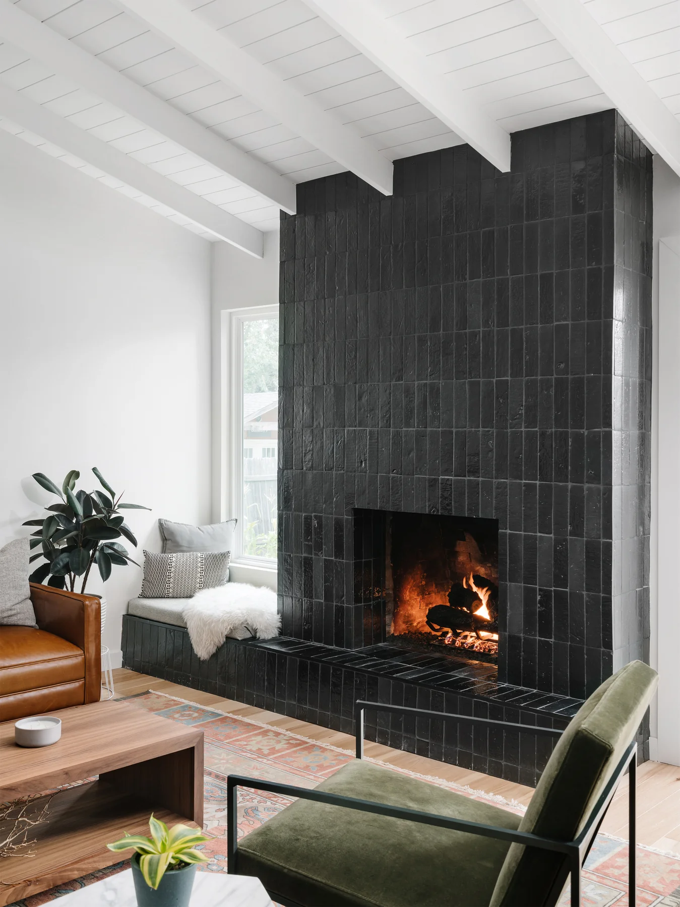 Modern fireplace design with black tiles