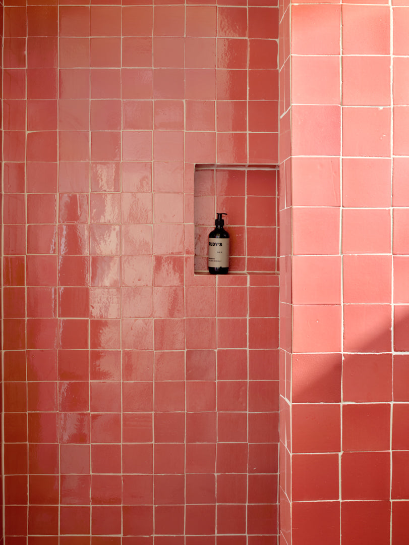 Shower niche with pink tiles