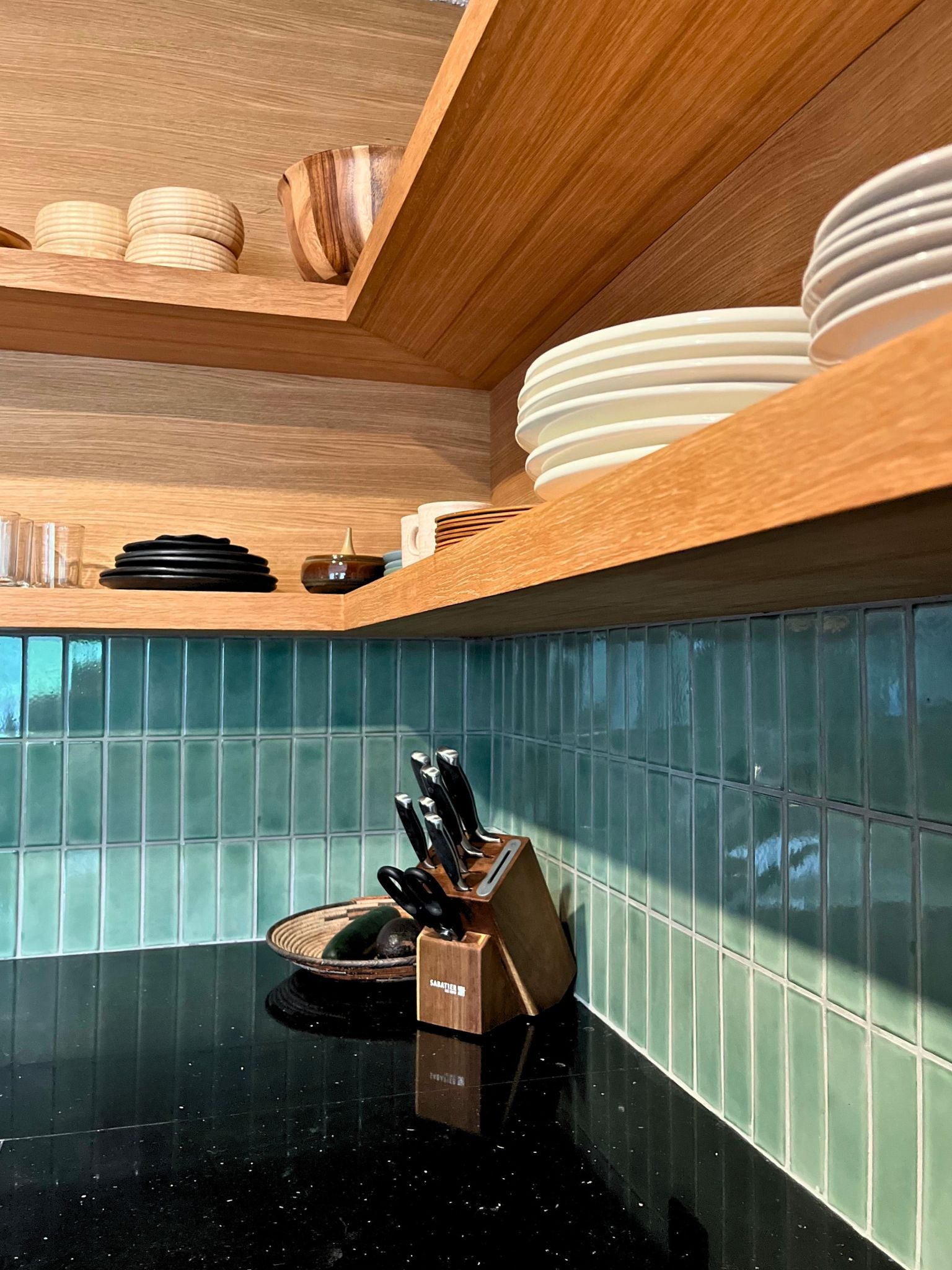 Kitchen backsplash with light green tiles