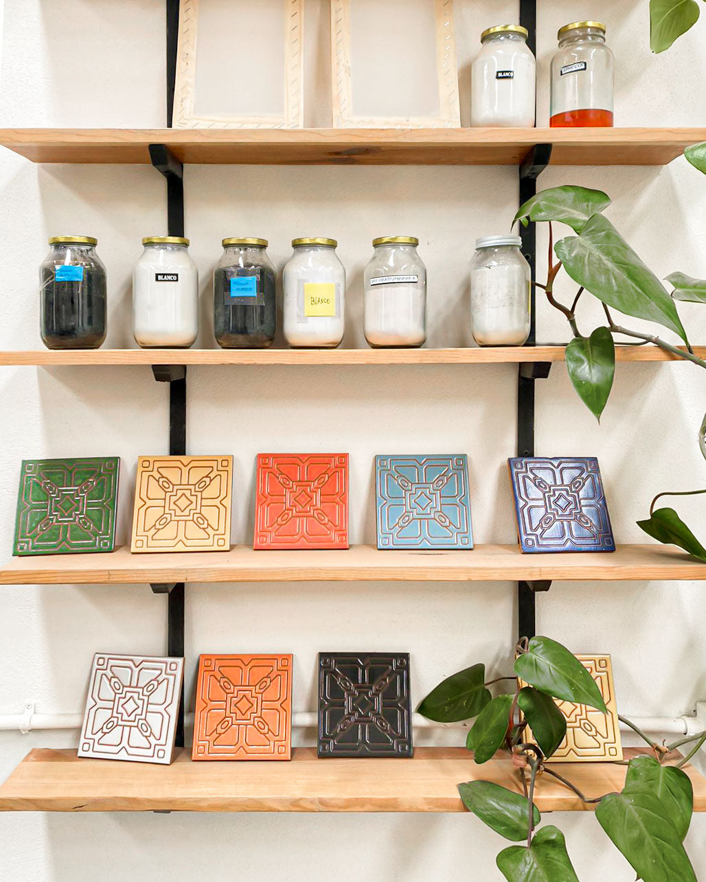 different color relief tile displayed on shelves clay imports