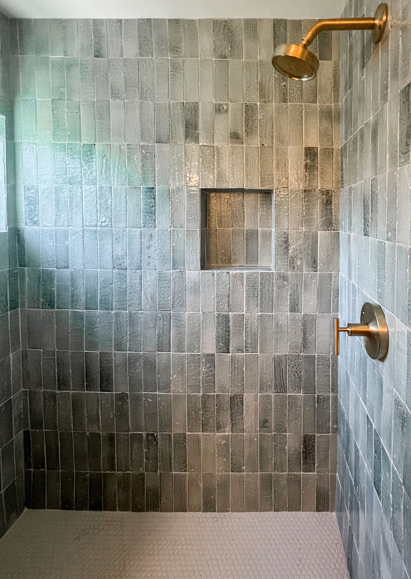 Shower with light green glazed tiles