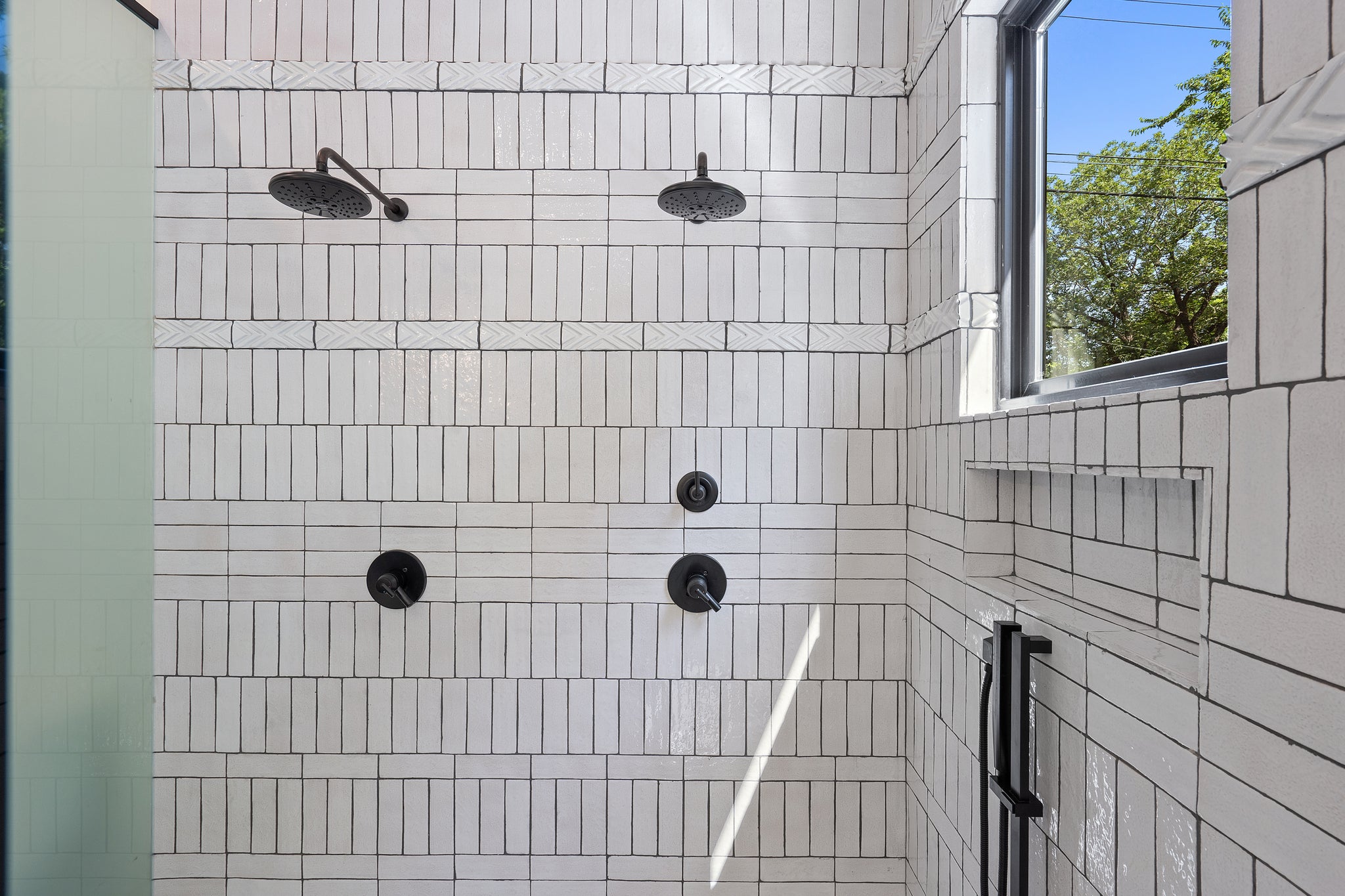 Modern shower design with white tiles