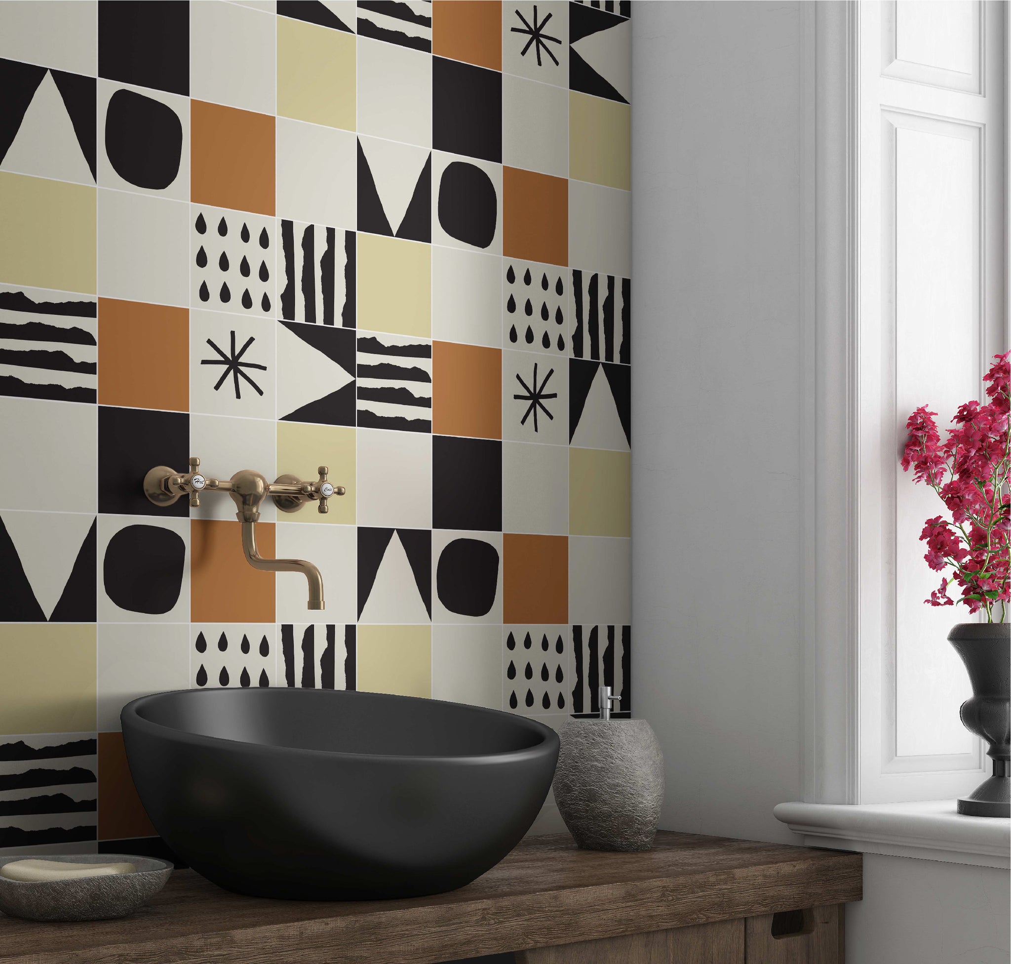 Kitchen with yellow, white, and orange tile with black designs on them backsplash wall by clay imports
