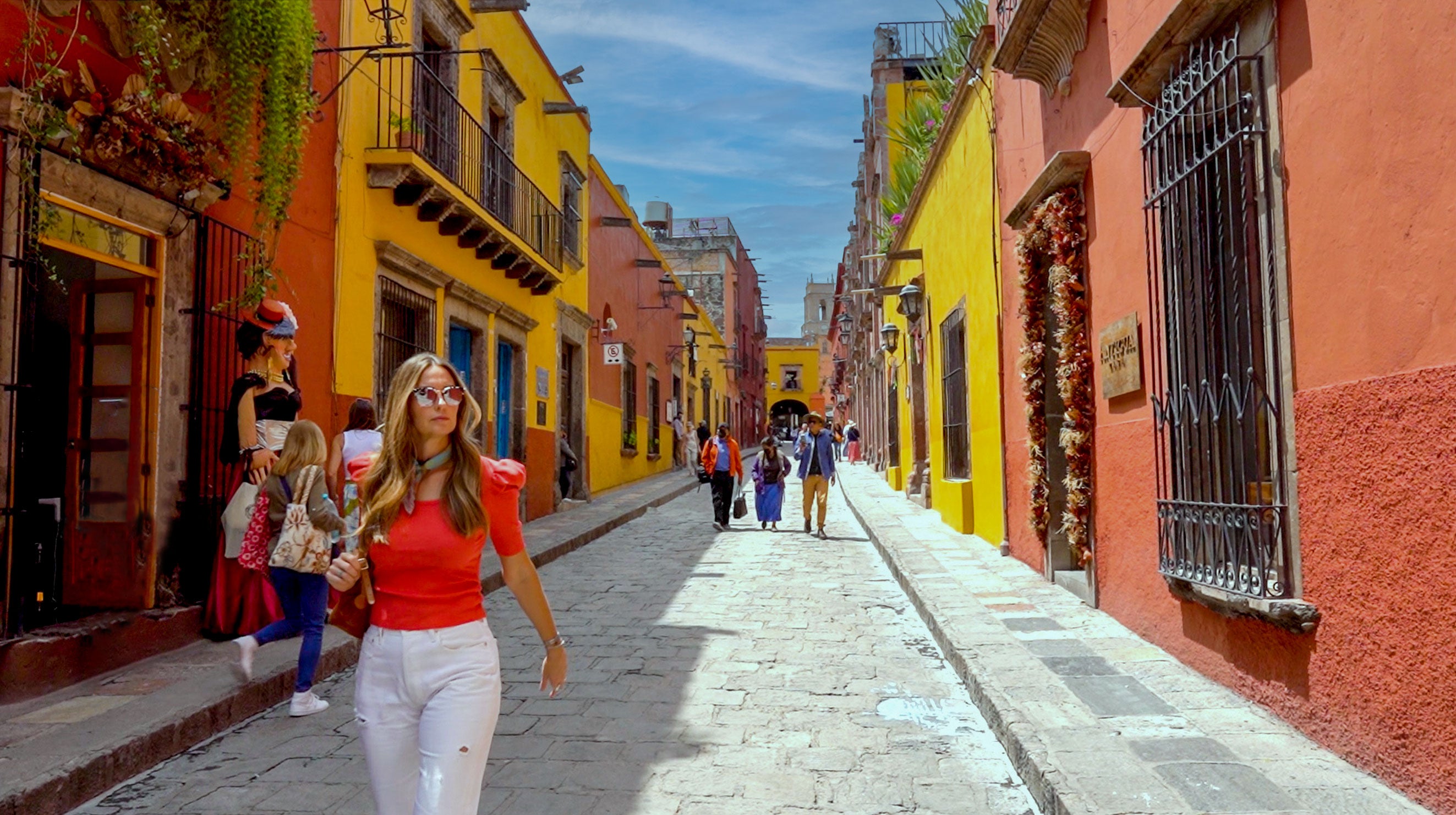 Kim Wolfe walking through downtown San Miguel De Allende, Mexico clay imports