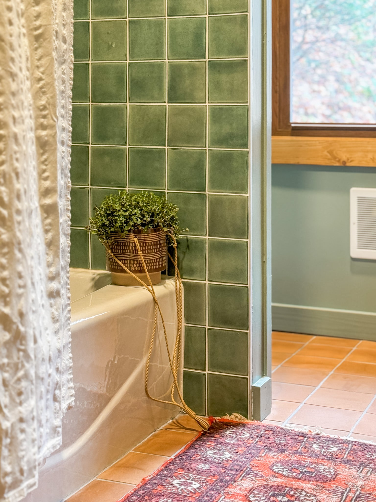 Modern bathroom design with light green tiles