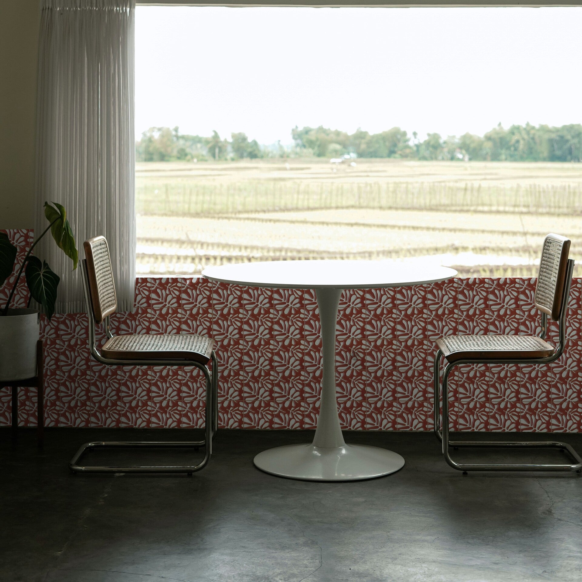 Accent wall with red and white flora patterned tiles