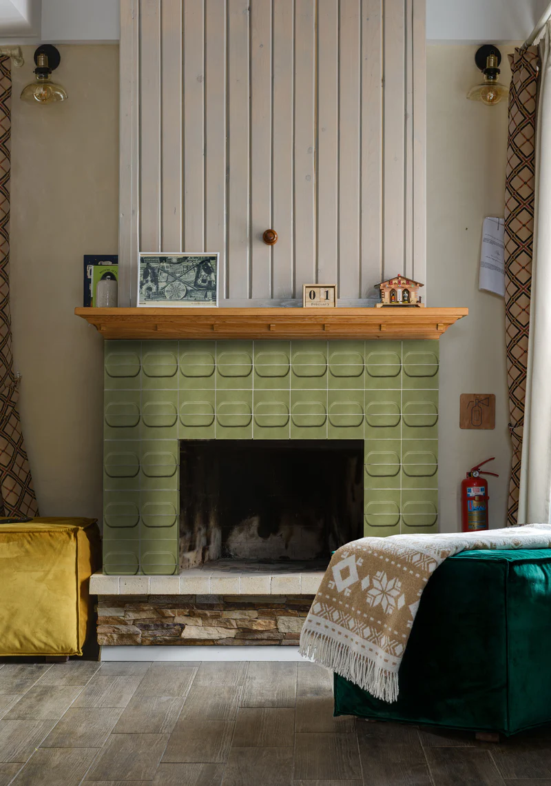 Modern fireplace design with green tiles