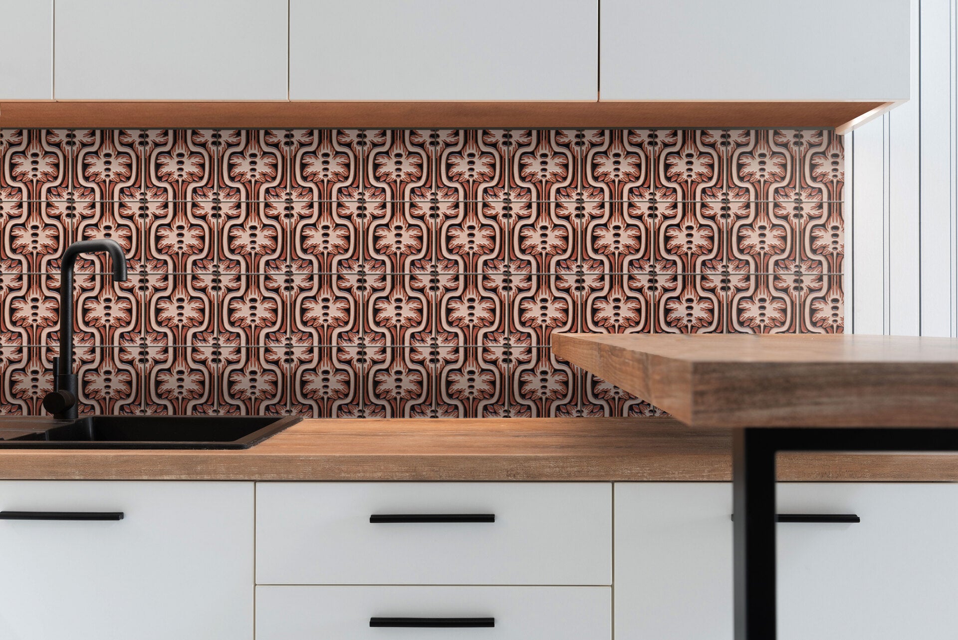 Kitchen backsplash with red and black floral tiles