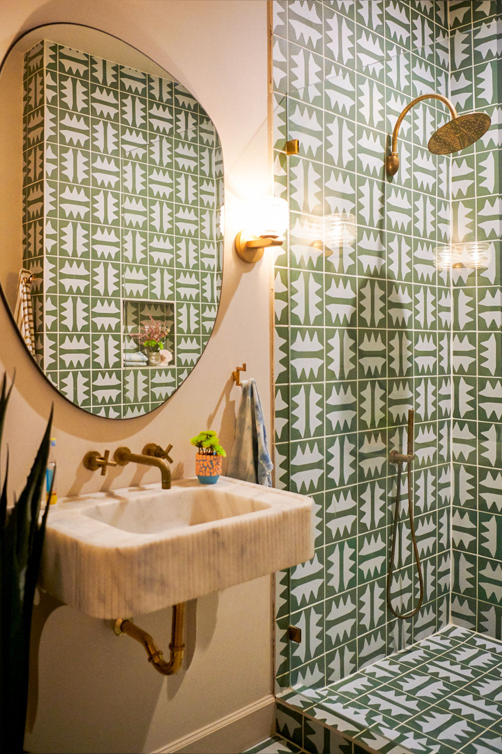 Modern bathroom design with green tiles and Schluter trim