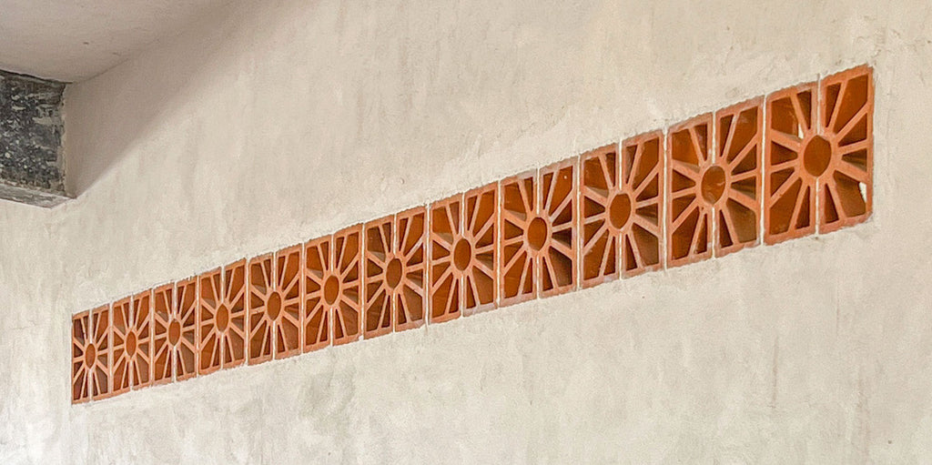 A row of Breeze Blocks into a stucco wall