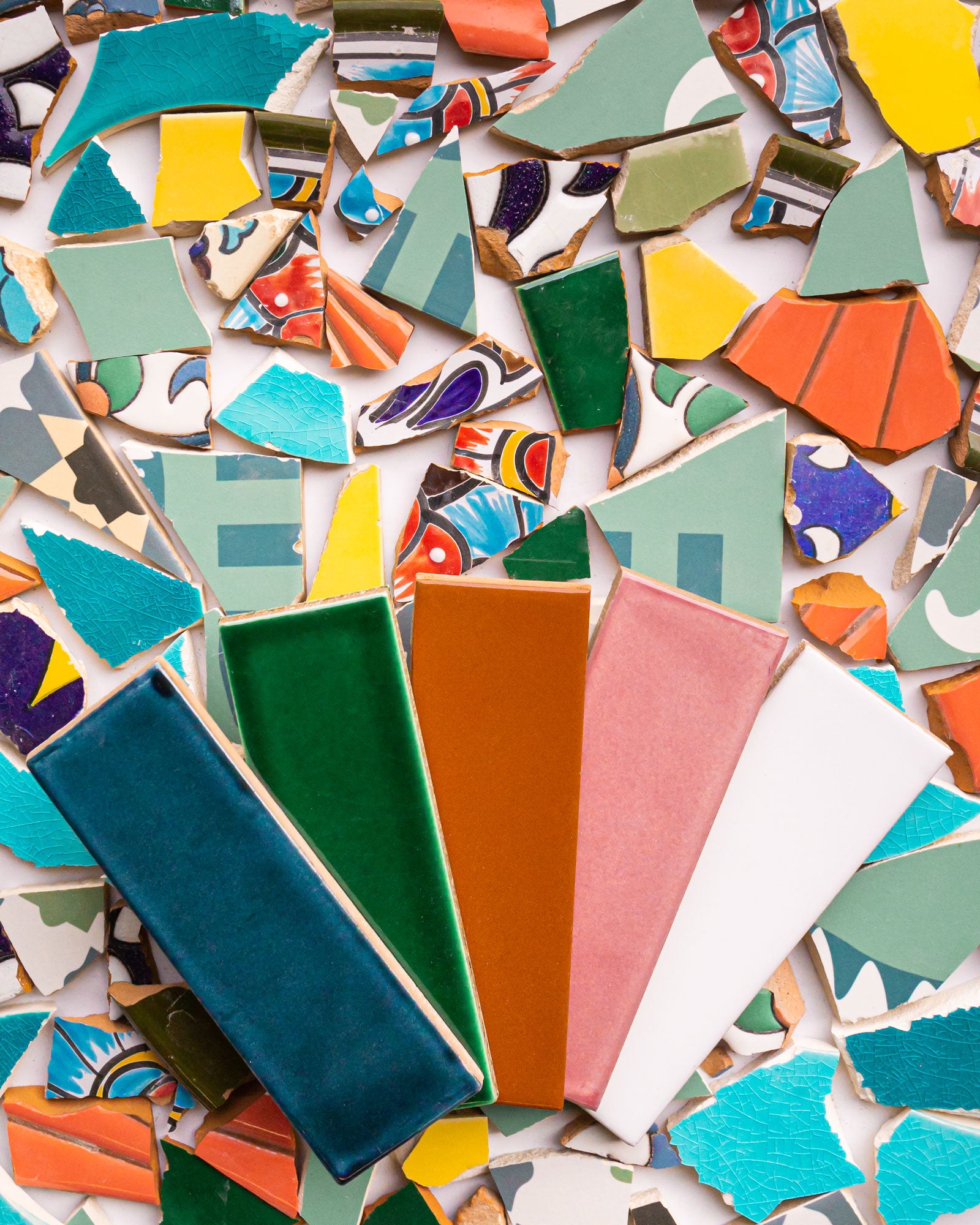 Colored tile with tile scraps used to make the recycled tile Clay Imports