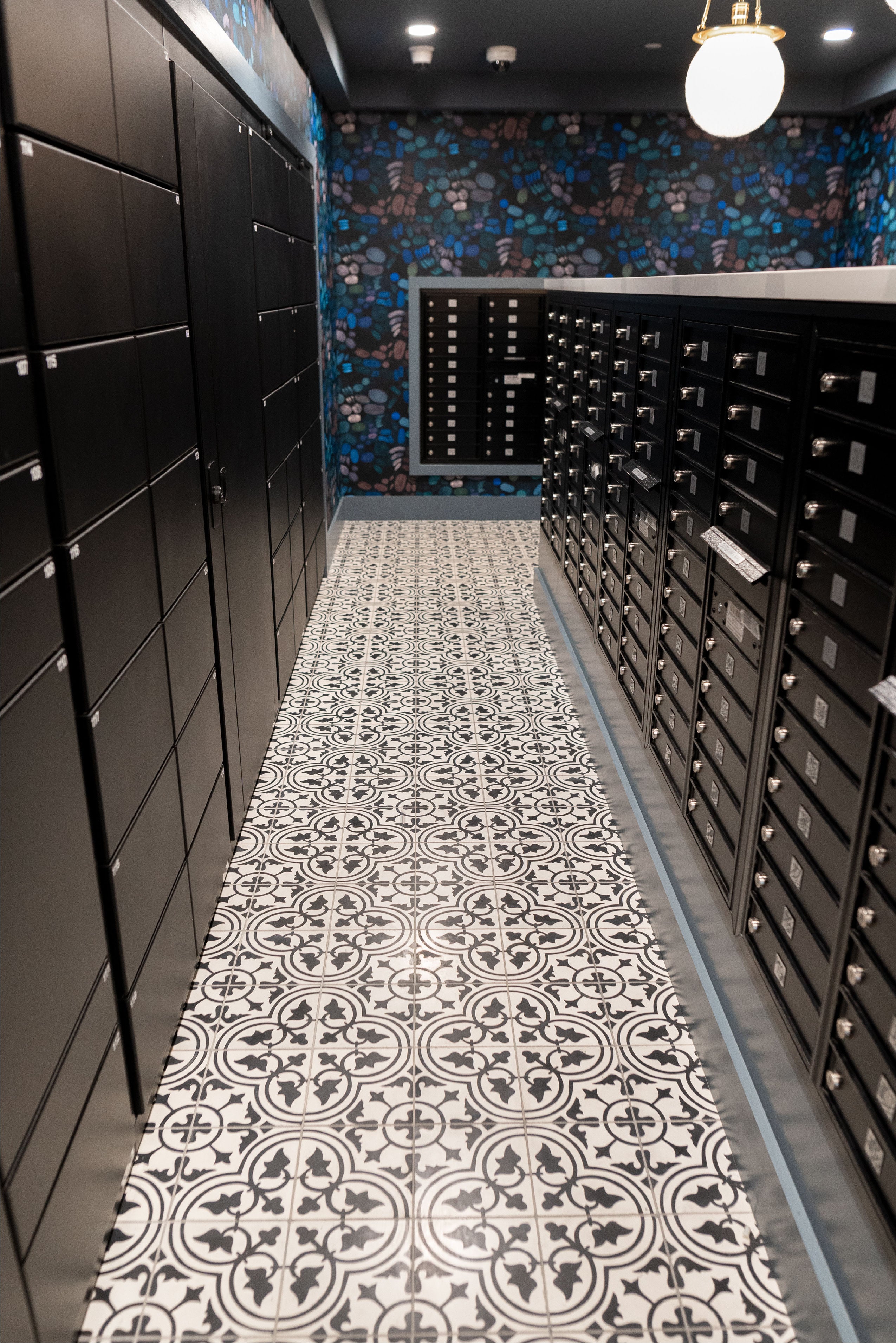 Mail room with pattern tile floor by clay imports