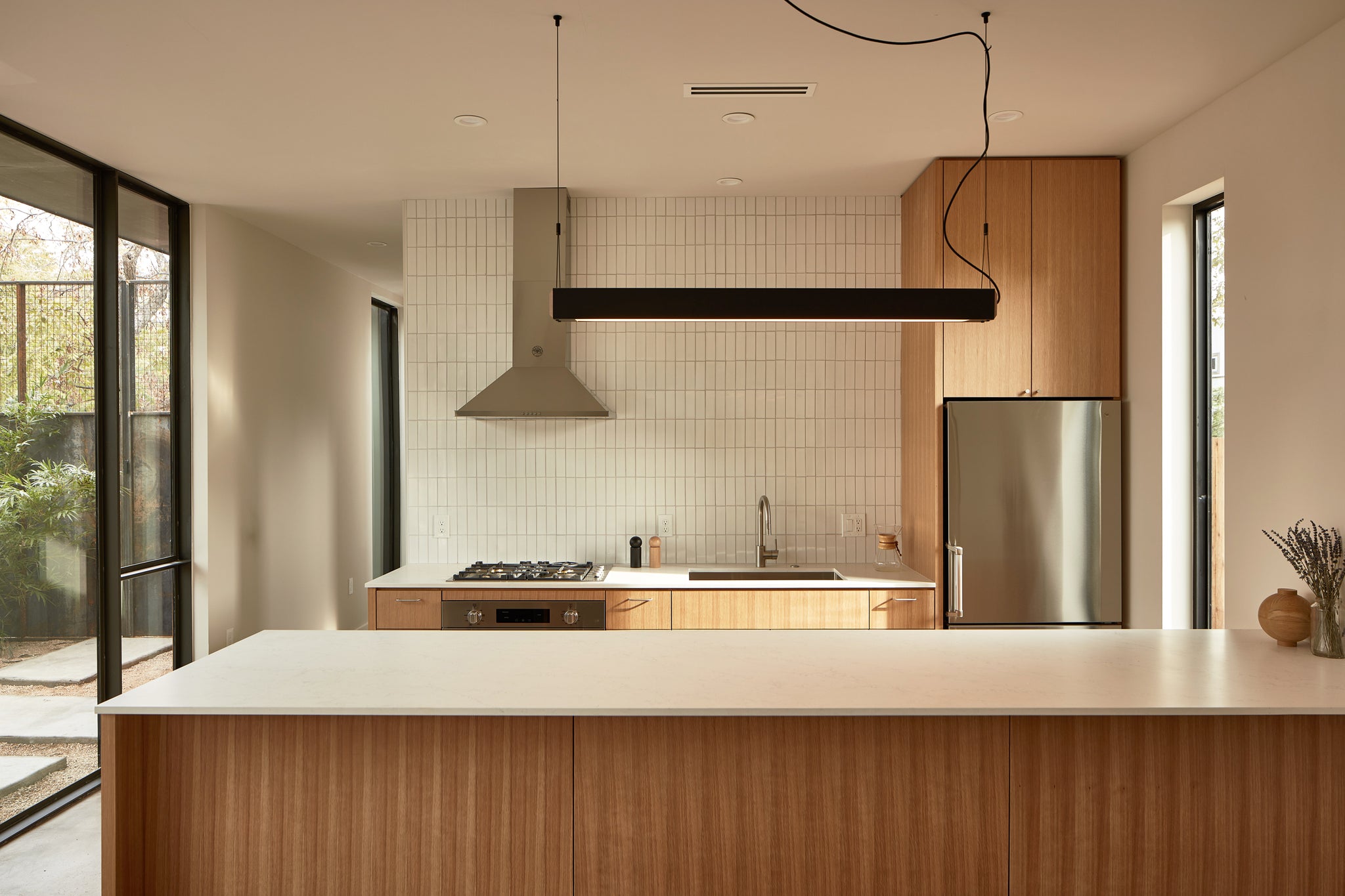 Modern kitchen design with white tiles